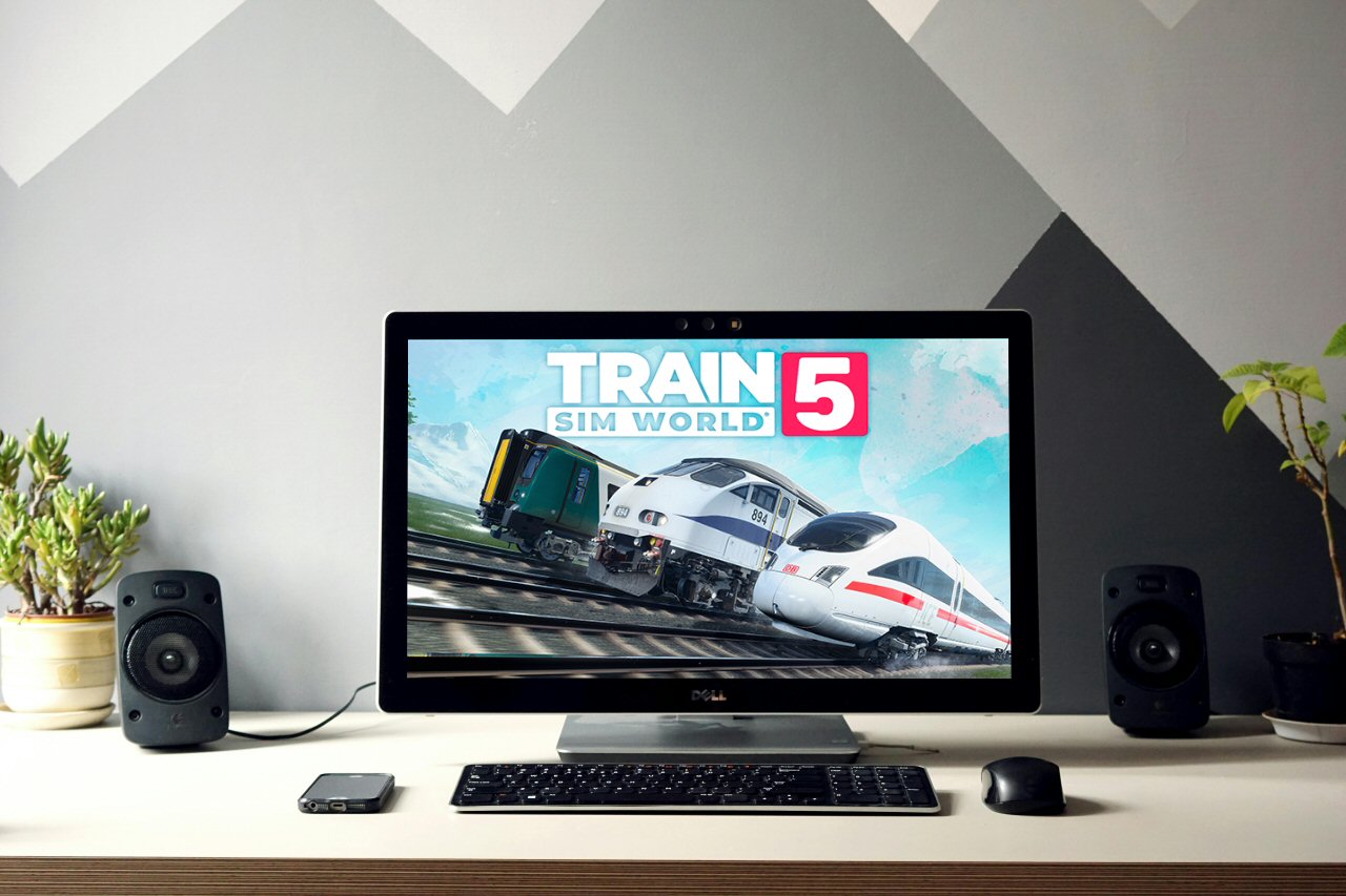 plaatje bureau met laptop met afbeelding Train Sim World